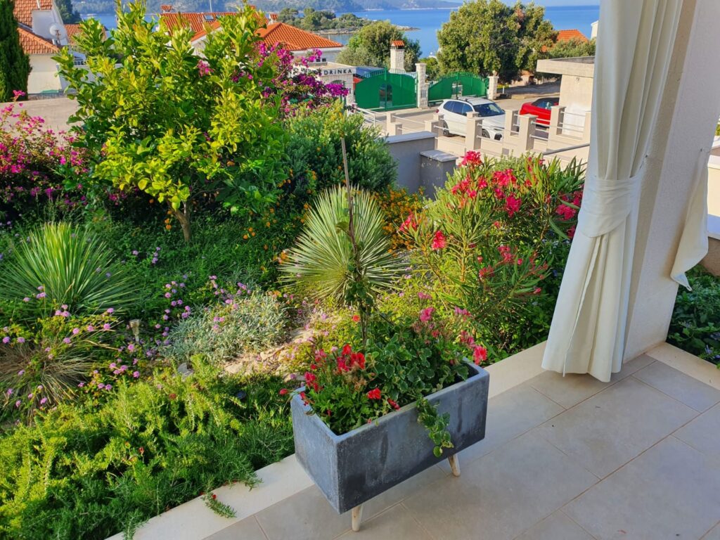 Flower garden viewed from a Villa ABBA balcony