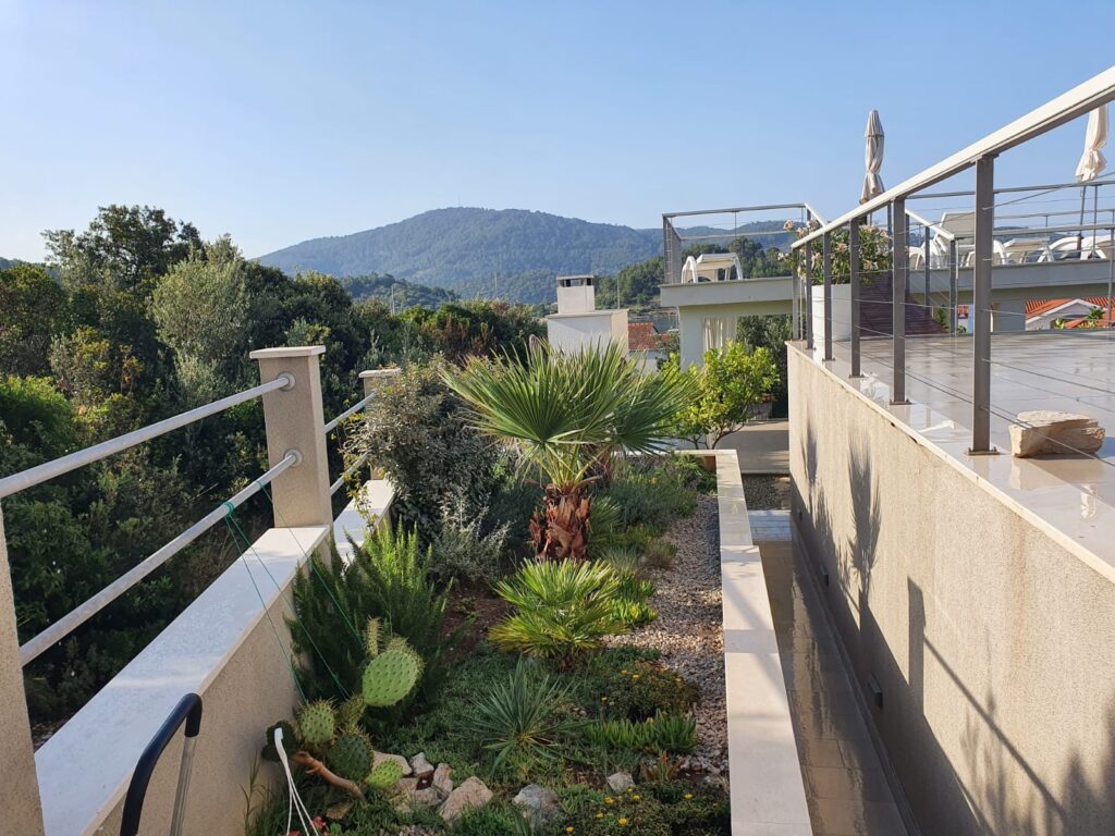 Terrace walkway beside the Mediterranean garden at Villa ABBA